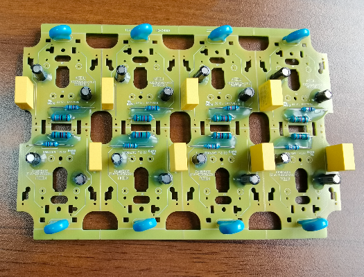 The power supply product has a capacitor resistor around the V slot